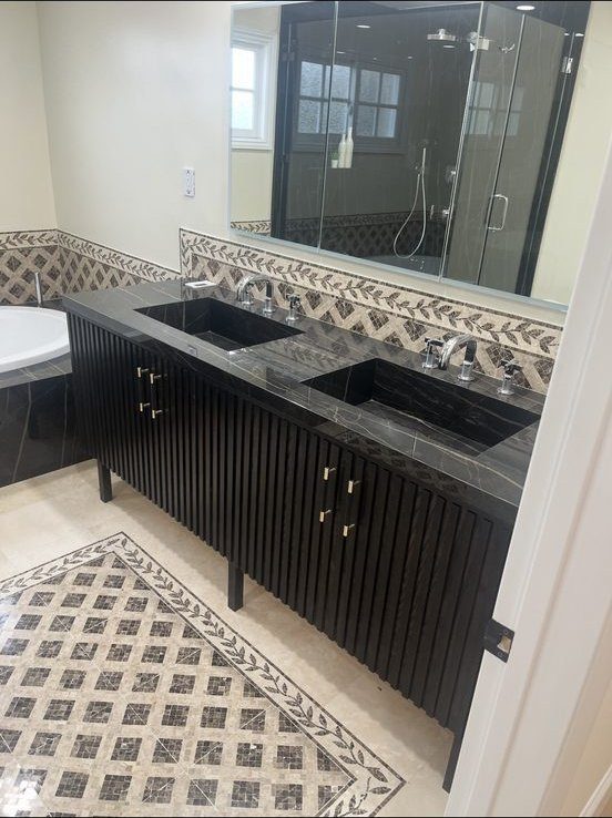 Dark double vanity with mosaic tile inlay