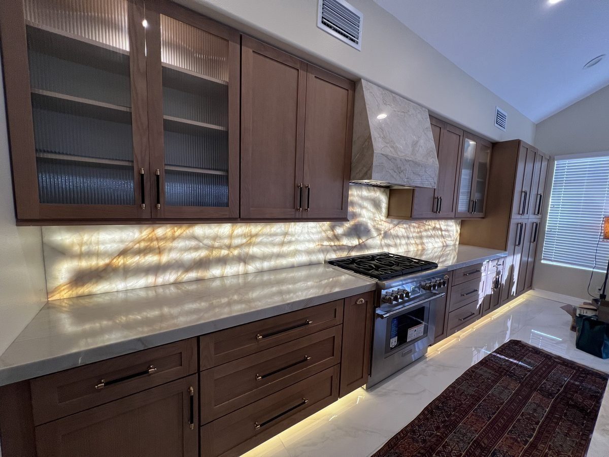 Luxury kitchen remodel with backlit onyx backsplash by Blue Diamond Construction