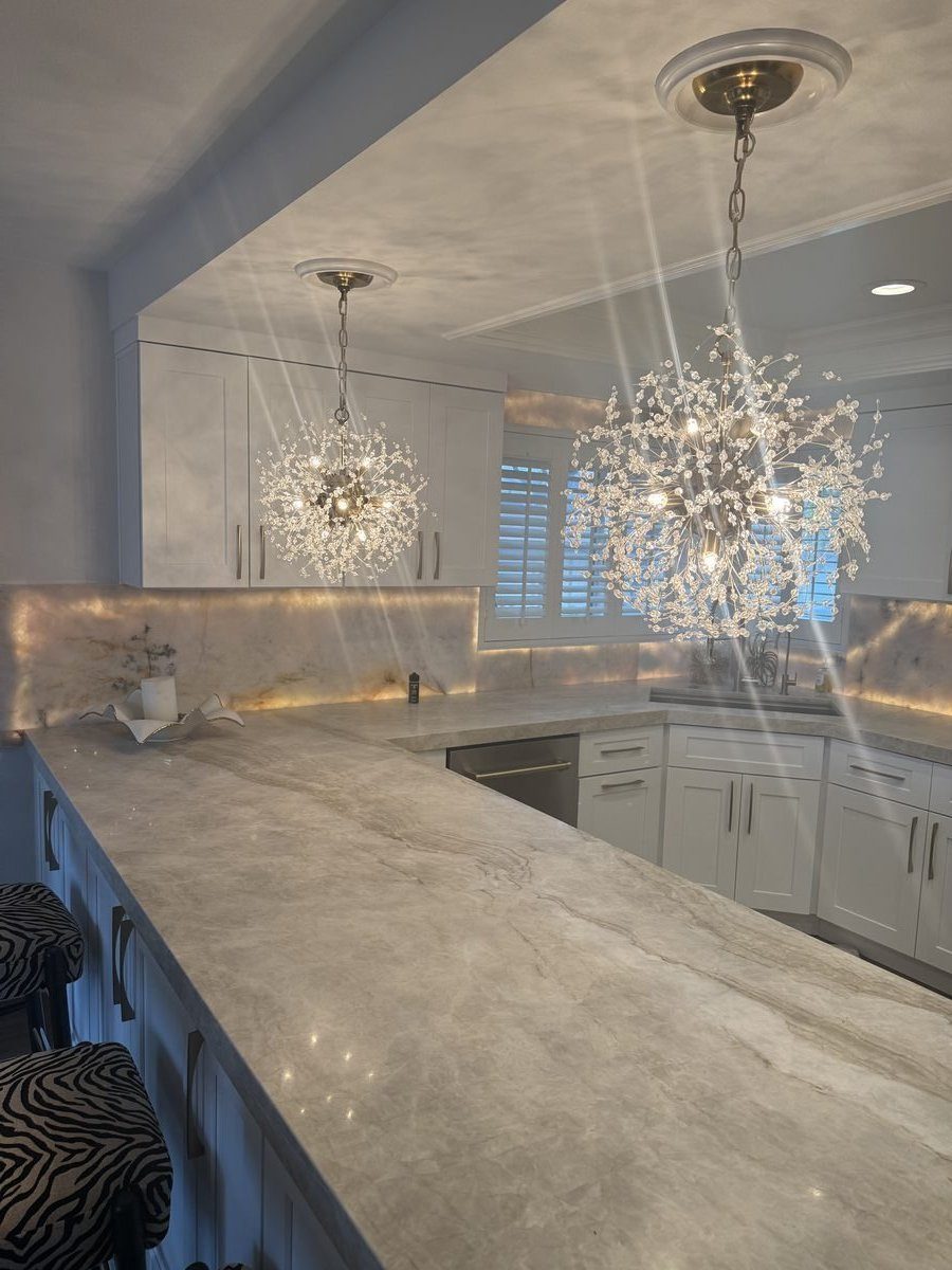 Crystal chandelier kitchen peninsula