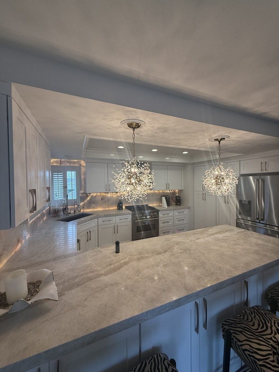 Kitchen with crystal chandeliers and quartzite countertops